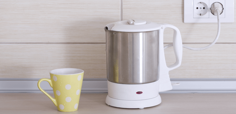 Kettle And Cup In Kitchen