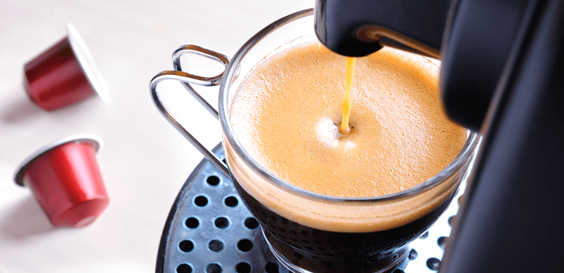 Coffee Being Poured From Machine Into Cup